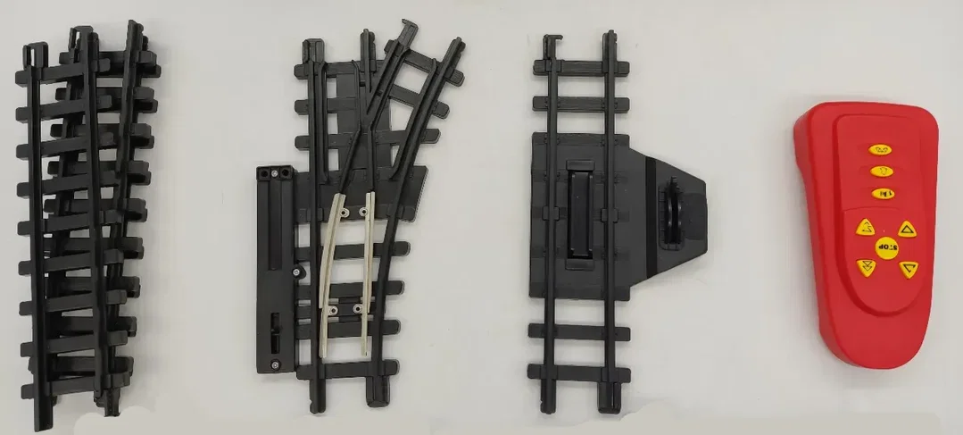 Modelleisenbahn mit 2 Wagons und Gleisen – Bild 3
